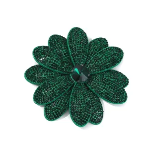 Green rhinestone flower brooch detail, sparkling crystal applique for diy craft.