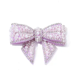 Purple pearl rhinestone bow shoe clip detail, sparkling crystal DIY decorative accessory.