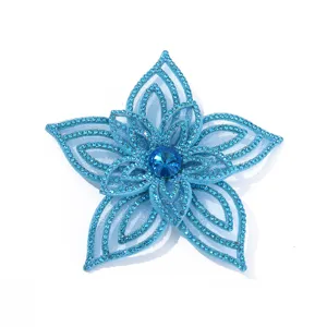 Blue rhinestone flower applique detail shot for DIY crafts apparel decoration.
