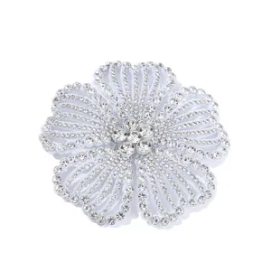 Sparkling rhinestone camellia flower accessory for shoes, hair clips, and garments.