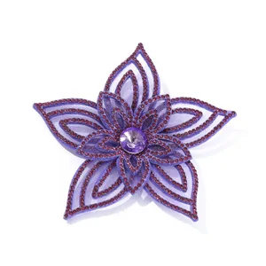 Detailed view of the 3D purple rhinestone flower applique, sparkling crystals and mesh design.