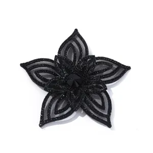 Detailed close-up of a black 3D crystal rhinestone flower applique patch, perfect for DIY.