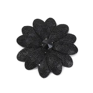 Detailed close-up of black rhinestone flower patch, sparkling crystal design for DIY shoe items.