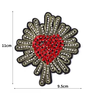 Close up of red rhinestone heart embroidered patch with gold rays showing size dimensions.