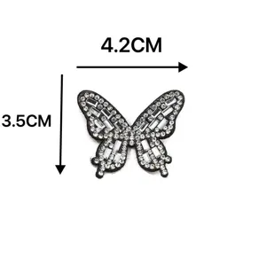 Detailed close-up of a sparkling crystal rhinestone butterfly patch accessory for DIY crafts.