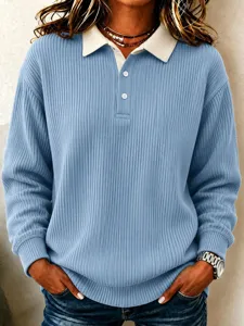 Blue ribbed knit long sleeve polo top with contrasting white collar for women detail shot.