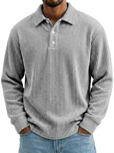 Close-up detail of mens corduroy long sleeve polo shirt, featuring lapel collar and buttons.