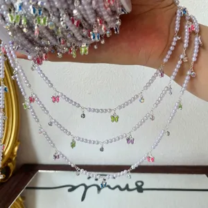 DIY pearl chain with colorful butterfly charms and rhinestones for Lolita hair accessories.