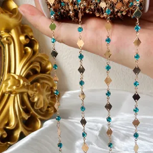Gold diamond chain detail shot, turquoise rhinestone metal DIY craft accessory for hair and crafts.