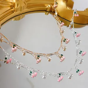 Catena di ciliegie smaltate rosa accessorio di gioielli con nappa in metallo vestiti.