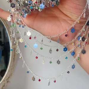 DIY metal jewelry chain with colorful rhinestones and small flower charms for handmade crafts.