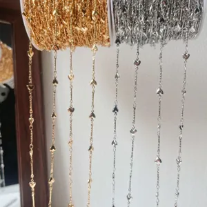 Metal heart chain DIY material detail showing gold and silver rolls with cute charms.