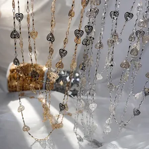 Copper hollow heart chain DIY jewelry accessory, gold and silver multi-strand display detail.