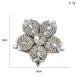 Close-up view of the sparkling rhinestone flower applique showcasing intricate crystal details.