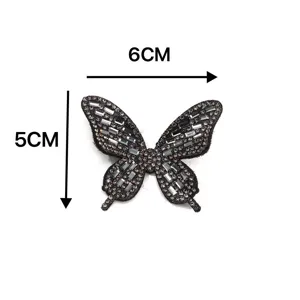 3D glass rhinestone butterfly DIY accessory detail shot, sparkling black crystal hair clip material.