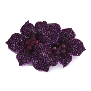 Close-up detail of double flower rhinestone shoe flower patch apparel accessory.