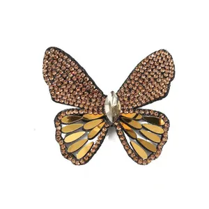 Detailed view of rhinestone butterfly patch, sparkling crystal sequin DIY craft accessory.