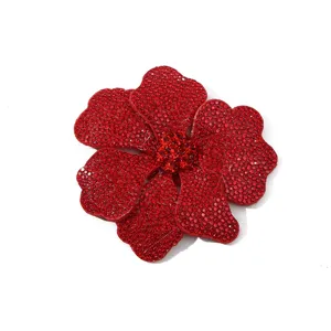 Red rhinestone flower detail shot, glittering crystal DIY patch accessory for dress shoes and bags.