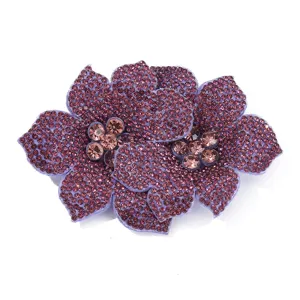 Detailed close-up of a double rhinestone flower shoe clip, sparkling purple crystals DIY accessory.