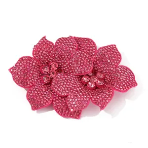 Close-up detail of sparkling pink crystal rhinestone flower applique, perfect for DIY shoes and crafts.