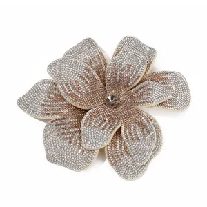 Close-up detail of large double-layer rhinestone flower, sparkling crystal decor for shoes/bags.