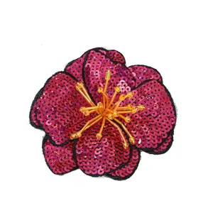 Detail shot of retro sequin flower patch, handmade embroidery applique for apparel, shoes and dresses.