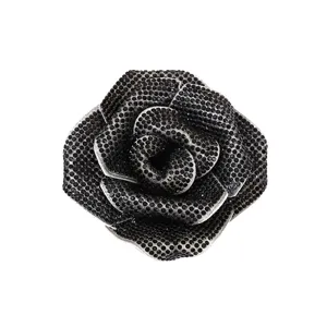 Detailed shot of vintage handmade 3D black rhinestone rose flower brooch accessory for women.