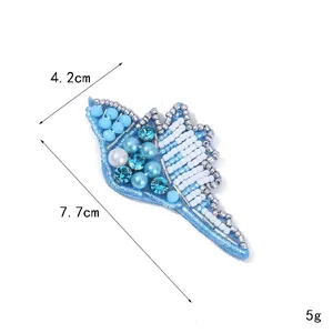 Handmade beaded shell patch DIY embroidered marine applique for clothing accessories.