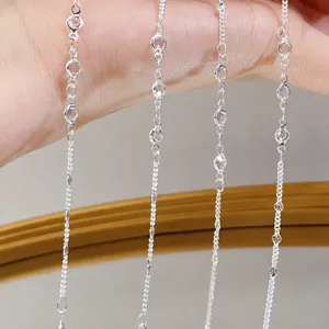 DIY silver tone delicate chain accessory detail shot, elegant tassel jewelry finding component.