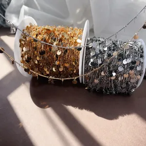 Detail view of gold and silver coin chain rolls, ideal for DIY jewelry crafting and hair accessories.