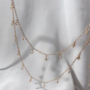 Close-up detail of double layer gold chain with crystal rhinestone charms for DIY accessories.