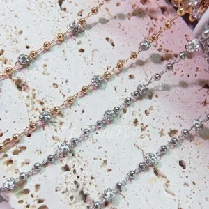 Close-up detail shot of exquisite rhinestone pave ball metallic chains, ideal for DIY jewelry crafting.