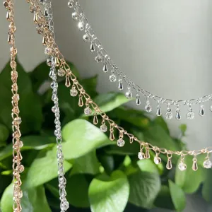 DIY copper rhinestone droplet chains, perfect for handmade necklaces and hair accessories detail.