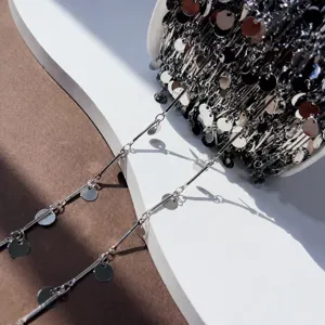 Detail shot of silver straight bar and round coin chain DIY jewelry making supply for hair accessories.