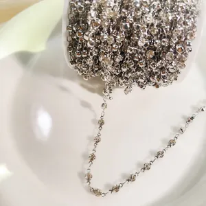 Rhinestone claw chain detail showing sparkling crystals and pure copper metallic finish.