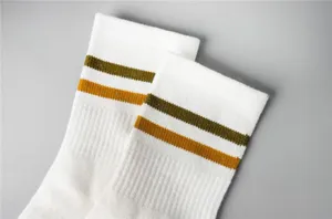 White retro stripe mid-calf socks for women, breathable cotton athletic tube socks detail.