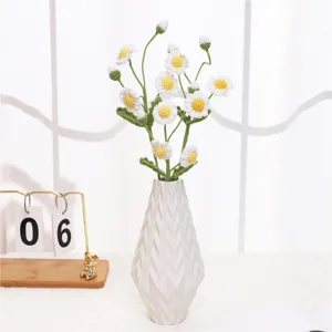 Handcrafted crochet daisy bouquet with ceramic vase, perfect cozy home decor and tabletop display.
