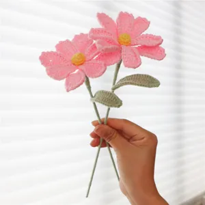Handmade crochet pink cosmos flower detail, knitted floral bouquet for home decor and gifting.