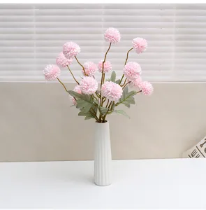 Artificial pink chrysanthemum flowers bouquet in white ceramic vase for home decor wedding props.