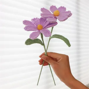 Handmade crochet flower detail, purple knitted blossom decor for home and office decoration.