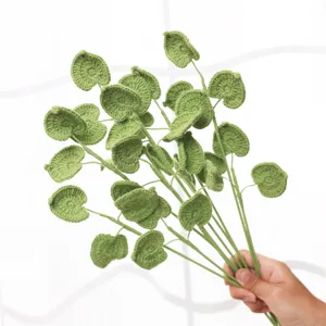Handmade crochet green leaf branch detail, perfect for floral arrangement and home decor.