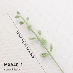 Detail shot of handmade knitted green eucalyptus plant stem branch for floral arrangement decor.