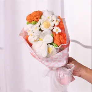 Handmade crochet flower bouquet detail view, beautiful orange and white knitted roses gift.