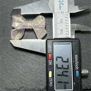 Acrylic glitter bow charm, translucent pink design for DIY jewelry and phone straps.