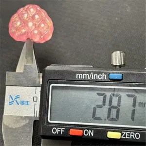 Detailed close-up shot of the pink luminous waffle heart DIY bead, measured with a digital caliper.