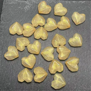 Acrylic faceted gold glitter heart beads for DIY jewelry making, keychains, and crafts.