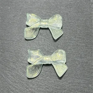 Translucent glitter acrylic bow beads for DIY phone chains and handmade jewelry crafting.