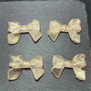 Acrylic translucent glitter bow charms for DIY jewelry phone chains beading crafts.
