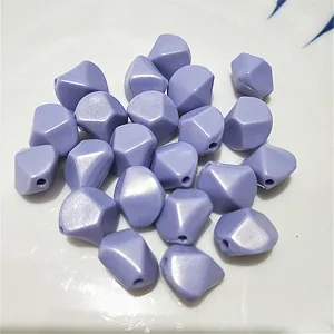 Detailed shot of pastel purple irregular faceted acrylic loose beads for DIY jewelry making.