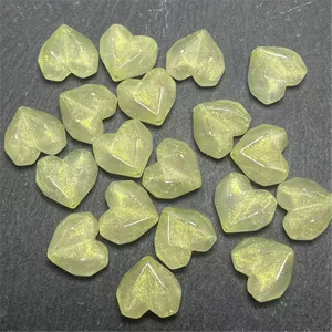 Green acrylic heart beads with gold powder sparkle for DIY jewelry making and crafts.